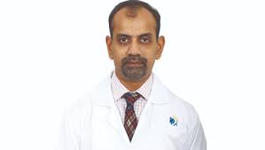 Dr Magesh R